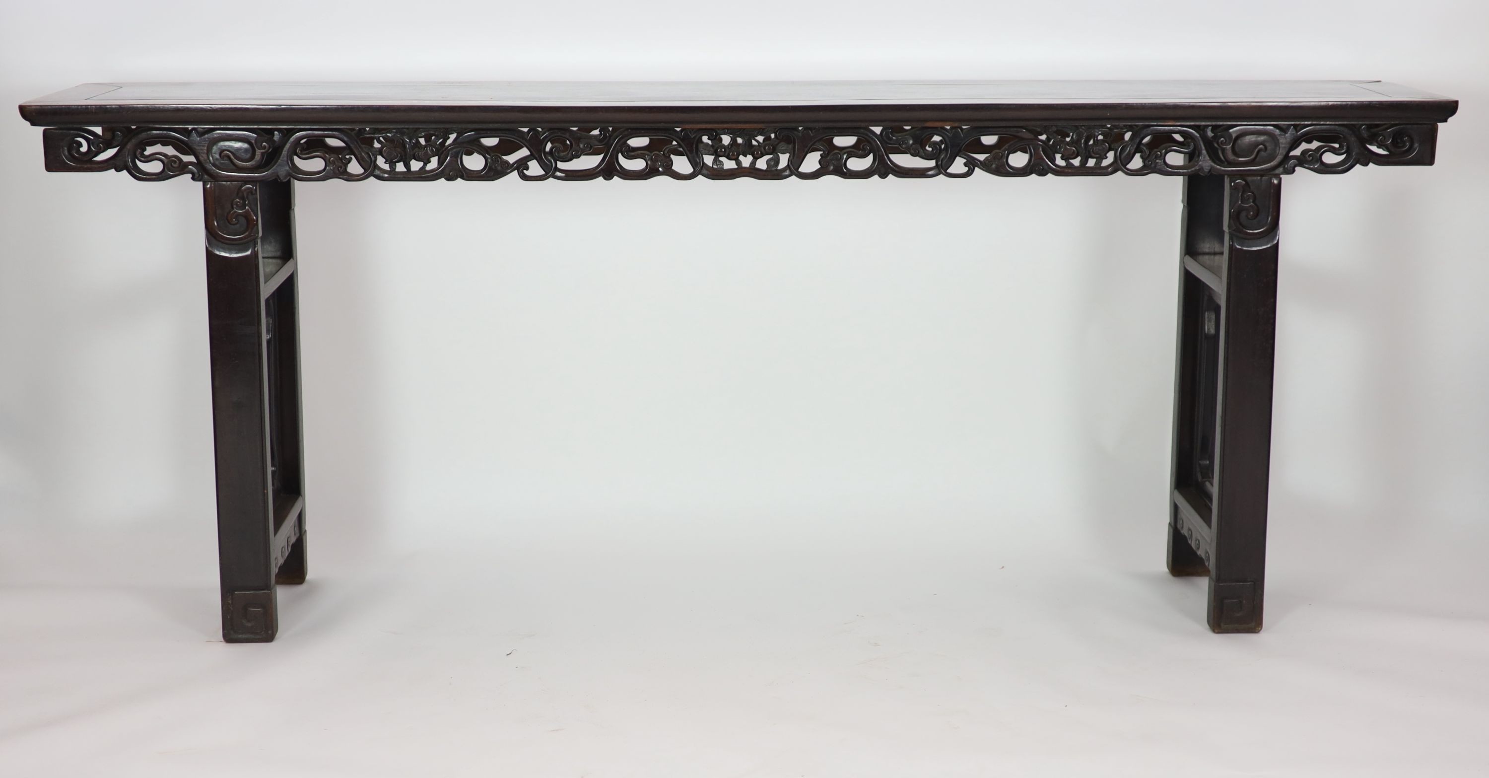 A large Chinese hongmu altar table, 19th century H 110cm. W 281cm. D 51.5cm.